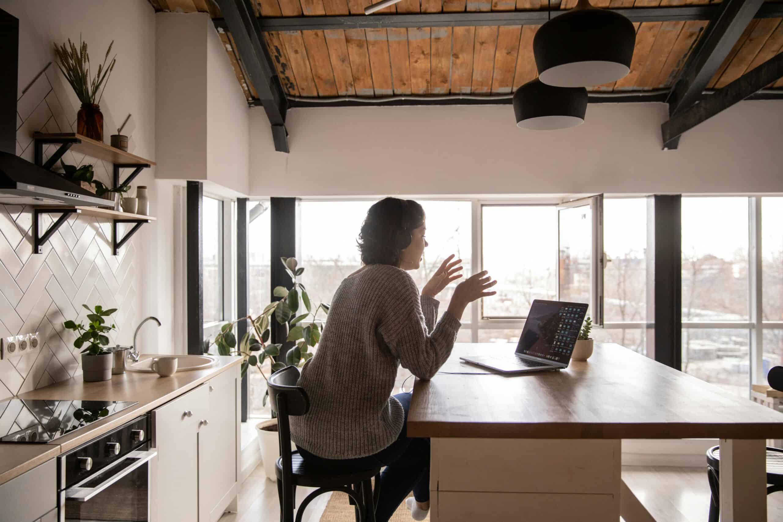 Woman sitting behind a table top