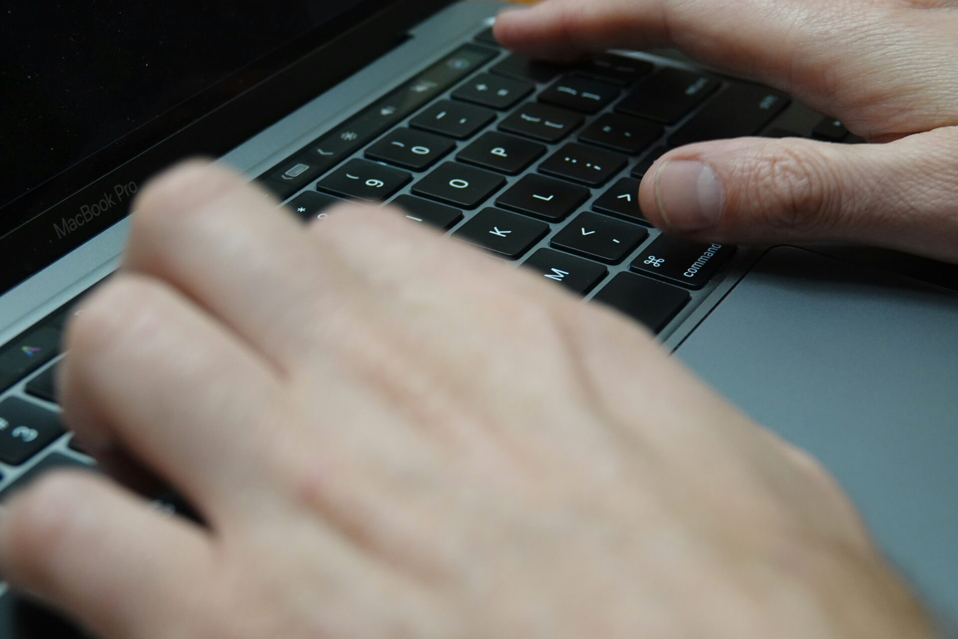 Person typing out a message on a keyboard