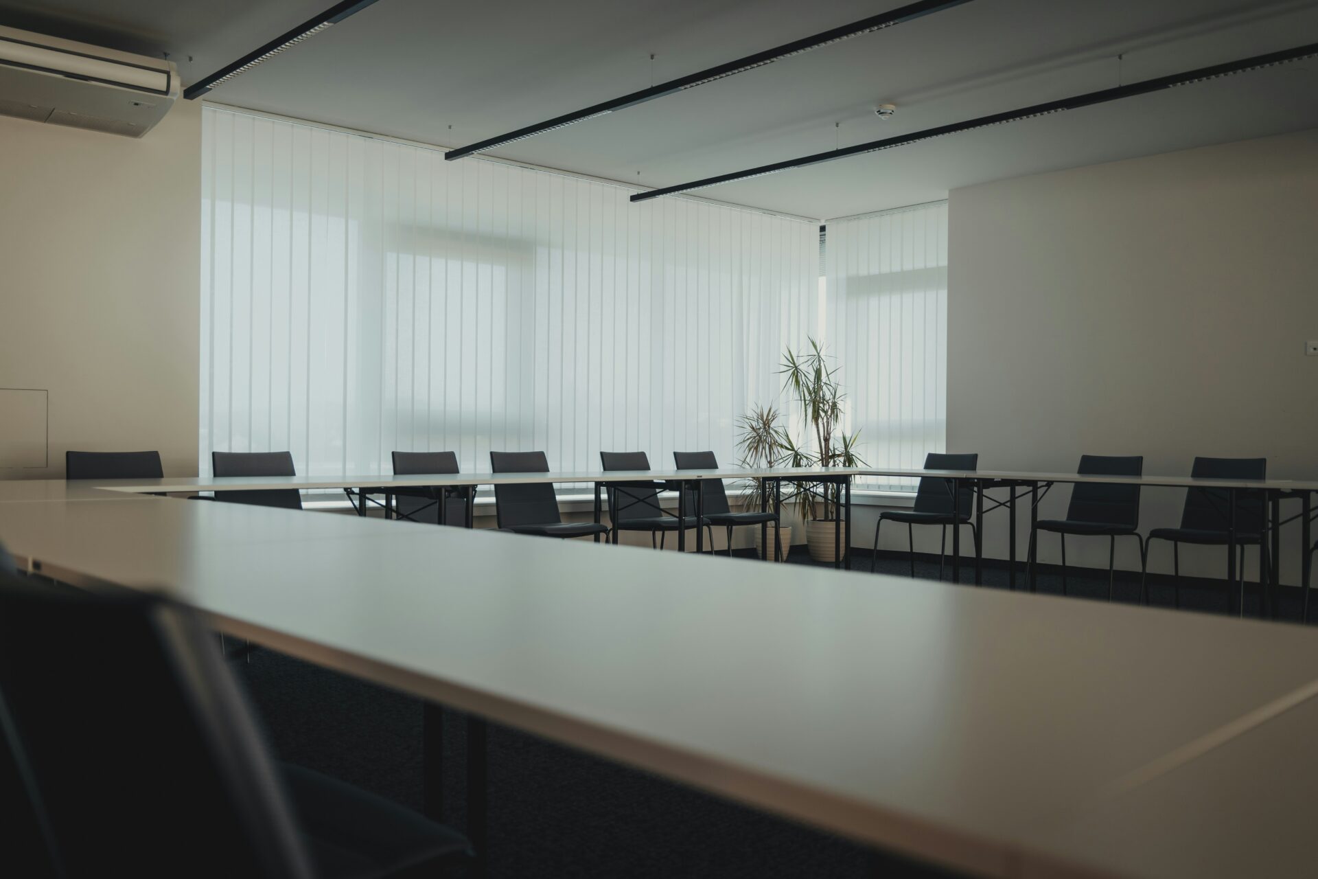 Empty chairs around a conference table