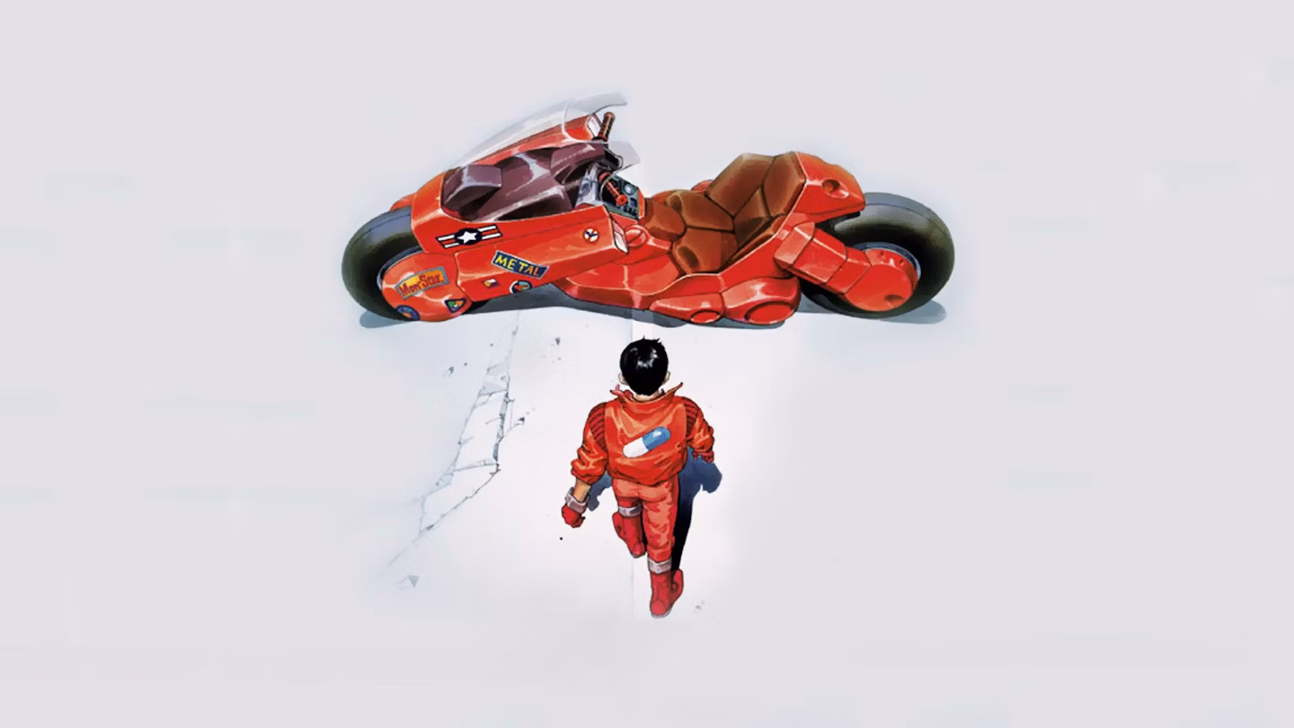 Person in a red leather suit walking up to a sweet looking red motorcycle