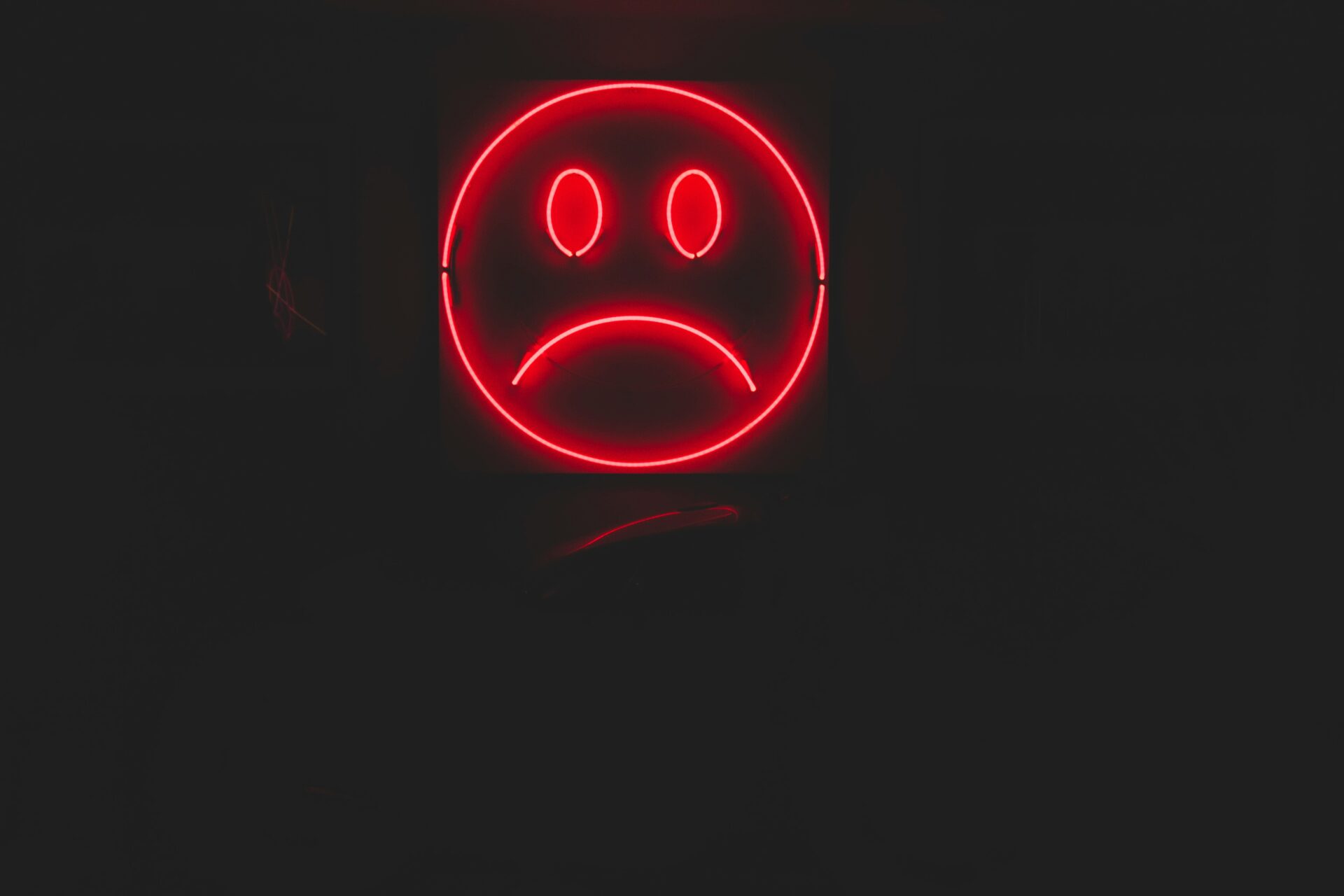 Red frown face