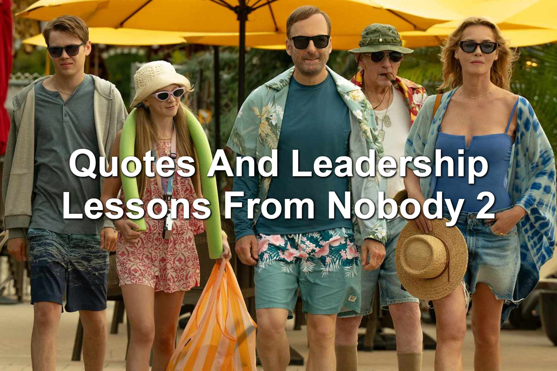 A scene from Nobody 2. The Mansell family is in swimming attire as they walk toward a pool