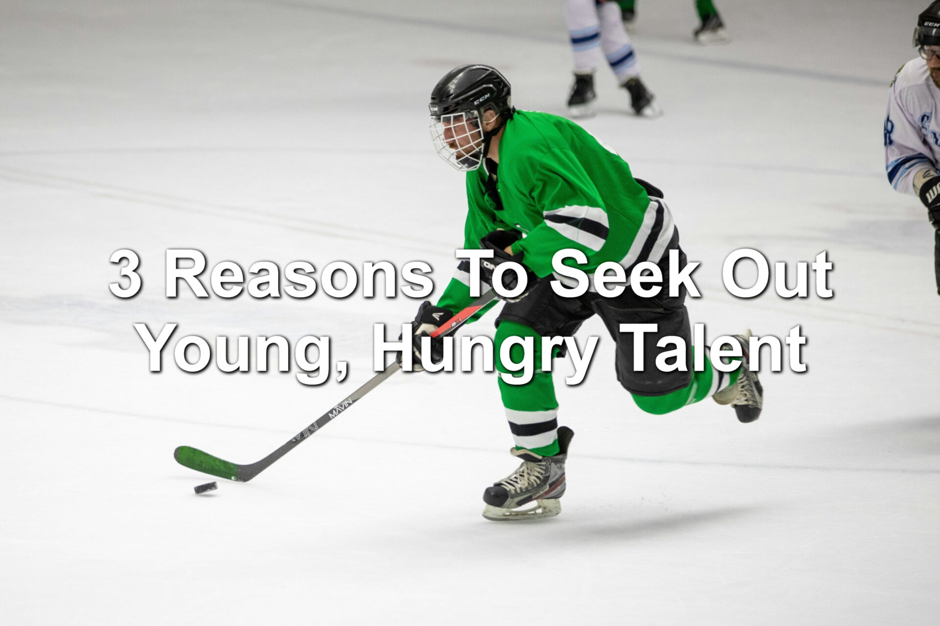 A high school student playing hockey in a green jersey