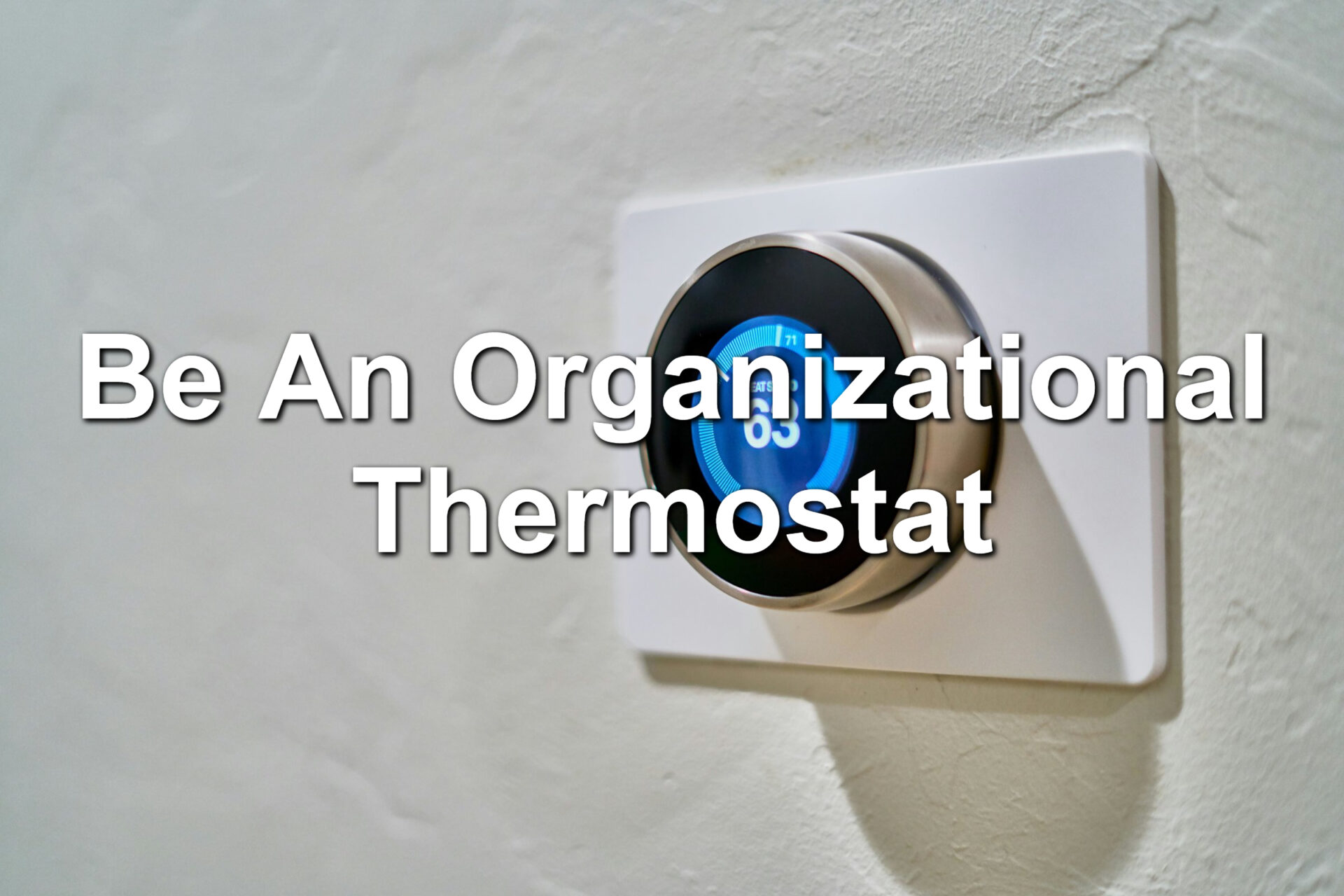 A Nest thermostat displaying the temperature of 63 degrees
