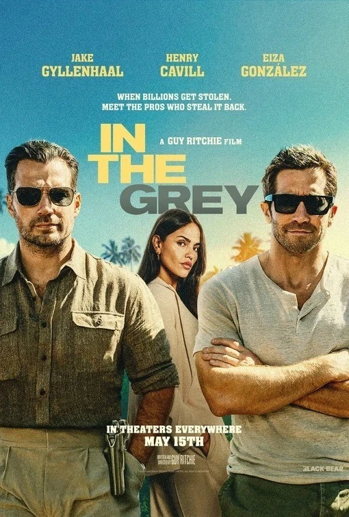 Movie poster for the film In The Grey. Two men and a woman are seen.