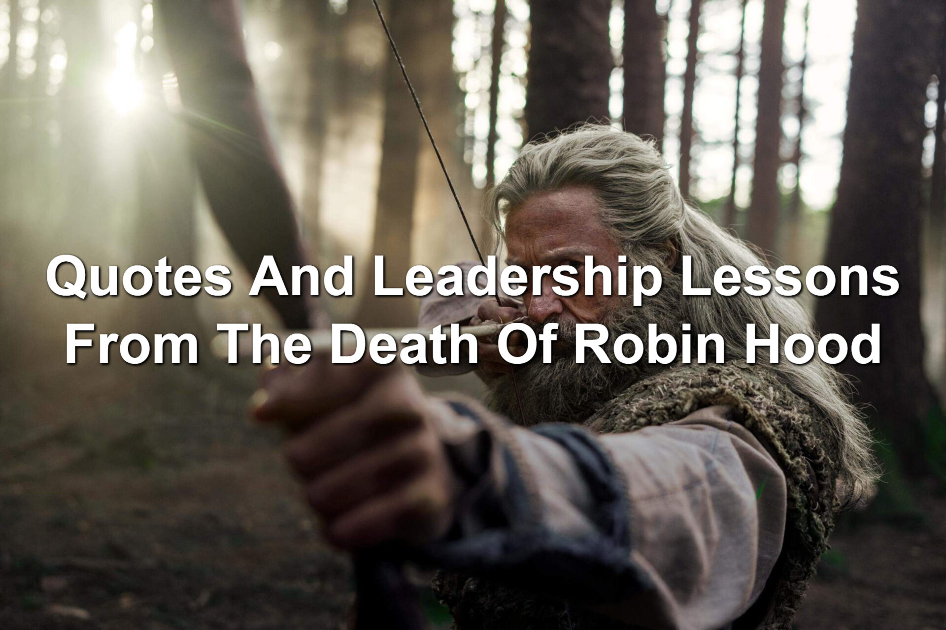 Man holding a bow. The bowstring is pulled taunt. A scene from The Death Of Robin hood staring Hugh Jackman.